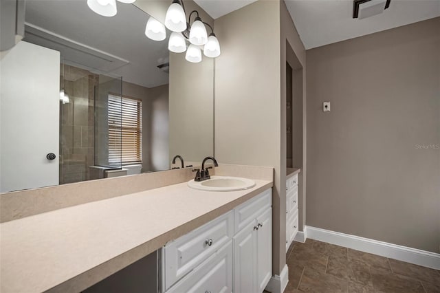 bathroom with vanity and a shower with shower door