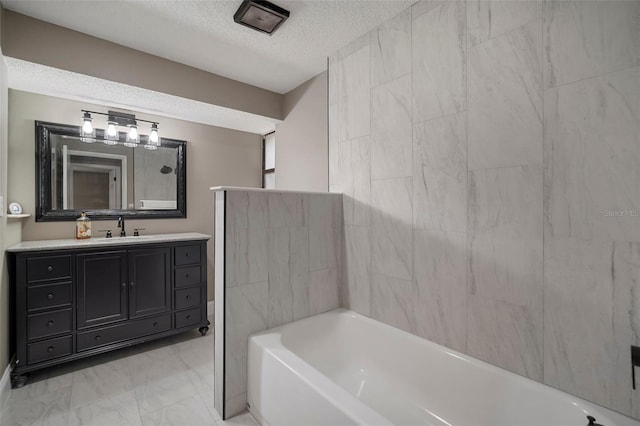 bathroom with vanity and a textured ceiling