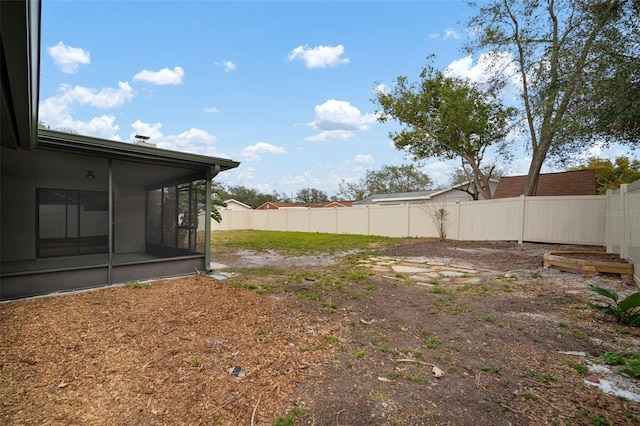 view of yard with a sunroom