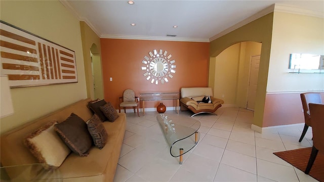 living area featuring crown molding and light tile patterned floors