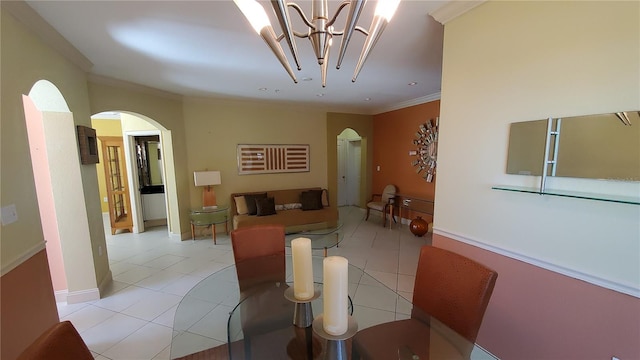 dining room featuring light tile patterned floors, a notable chandelier, and ornamental molding