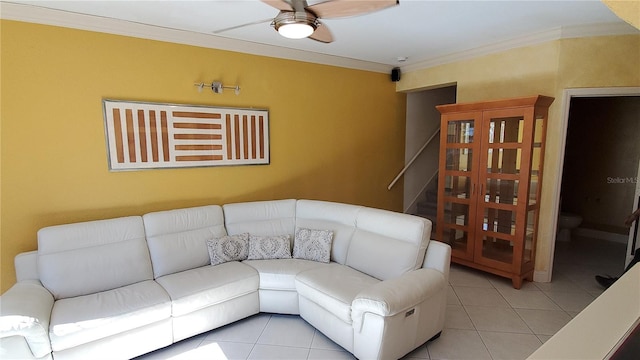 living room featuring crown molding, ceiling fan, and light tile patterned flooring