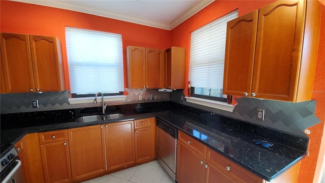 kitchen featuring dark stone countertops, sink, decorative backsplash, and appliances with stainless steel finishes