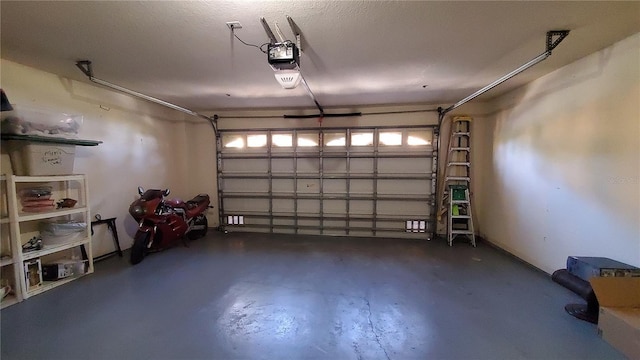 garage featuring a garage door opener