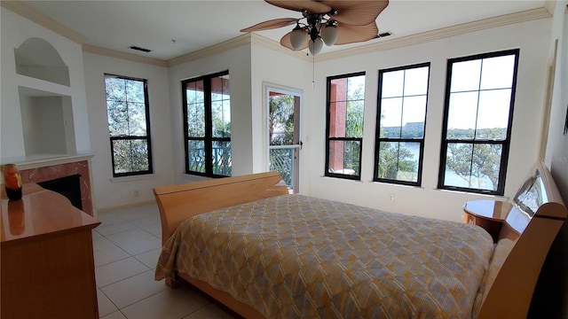 tiled bedroom featuring ceiling fan and ornamental molding