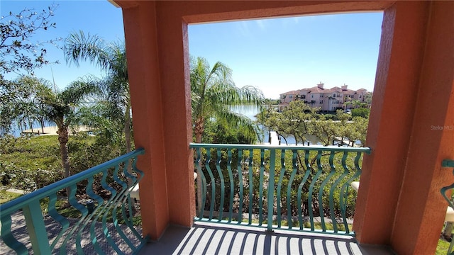 balcony featuring a water view