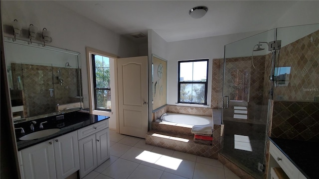 bathroom with vanity, tile patterned floors, independent shower and bath, and a healthy amount of sunlight