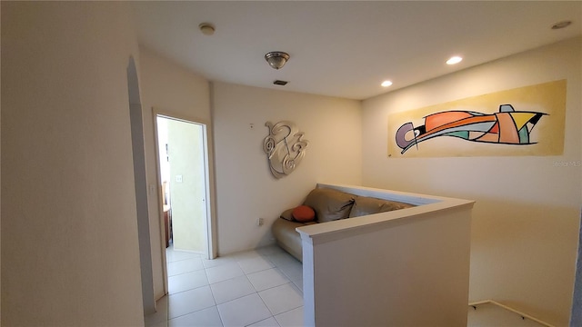 hallway featuring light tile patterned floors