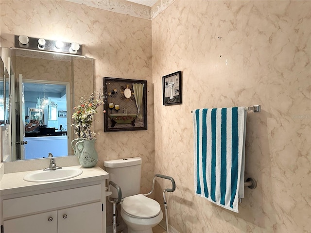 bathroom featuring vanity and toilet