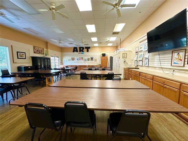 2116 Nantucket Dr Unit 19, Sun City Center, FL 33573 - dining area with plenty of natural light, a paneled ceiling, wood finished floors, and ceiling fan
