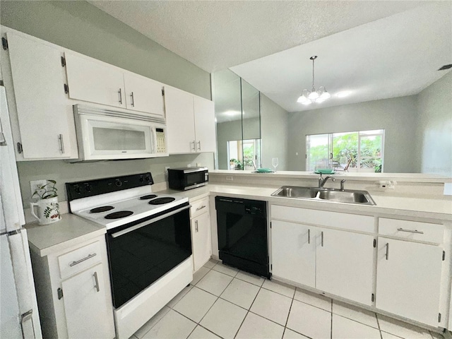 2116 Nantucket Dr Unit 19, Sun City Center, FL 33573 - kitchen with a sink, light tile patterned flooring, white appliances, light countertops, and white cabinetry