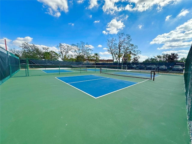 2116 Nantucket Dr Unit 19, Sun City Center, FL 33573 - view of tennis court featuring fence