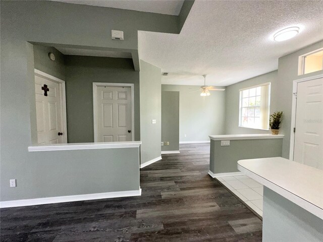 2116 Nantucket Dr Unit 19, Sun City Center, FL 33573 - entrance foyer featuring dark wood-type flooring, a textured ceiling, baseboards, and ceiling fan