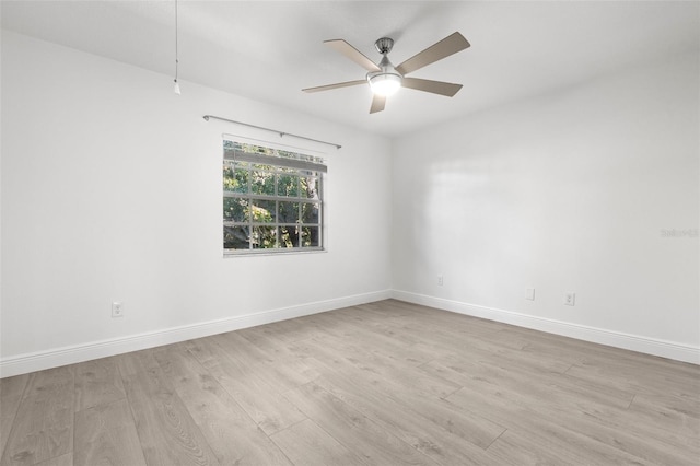 empty room featuring ceiling fan and light wood-type flooring