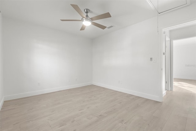 unfurnished room with ceiling fan and light wood-type flooring