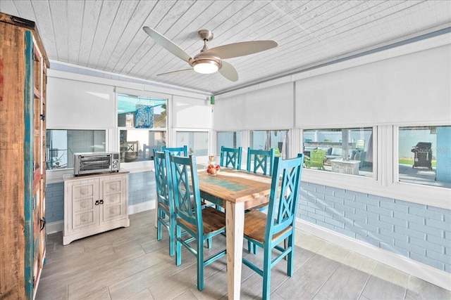 sunroom with wood ceiling and ceiling fan