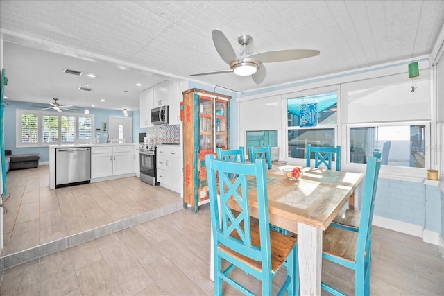 dining room with ceiling fan