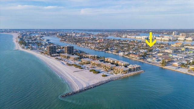 drone / aerial view featuring a view of city, a beach view, and a water view