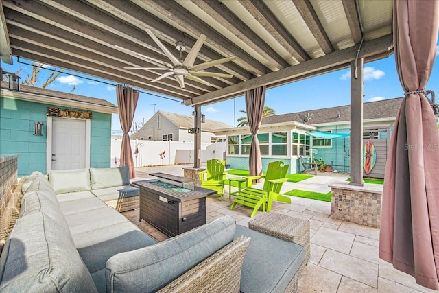 view of patio featuring a residential view, an outdoor living space with a fire pit, ceiling fan, and a fenced backyard