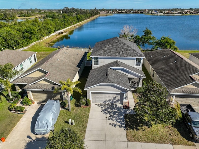 birds eye view of property with a water view