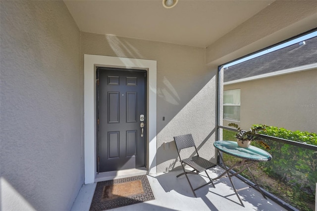 doorway to property featuring a balcony