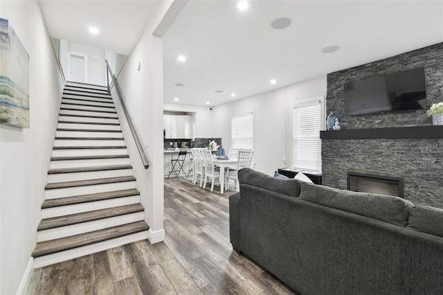 living room featuring hardwood / wood-style flooring and a fireplace