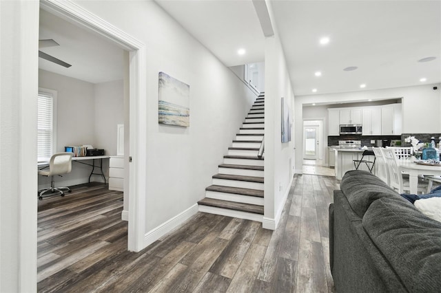 stairs with hardwood / wood-style floors