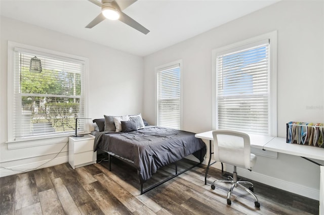 bedroom with hardwood / wood-style floors and ceiling fan