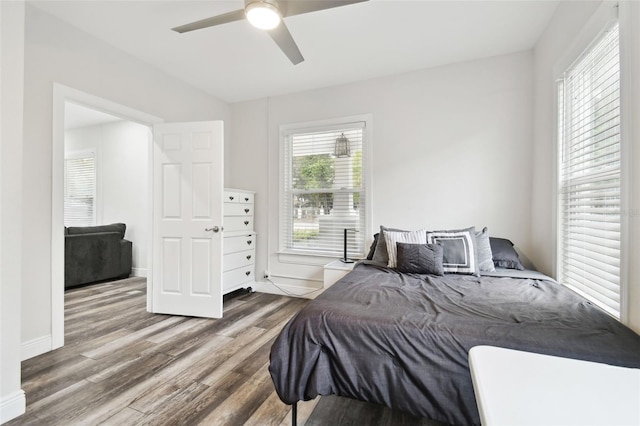 bedroom featuring wood-type flooring and ceiling fan