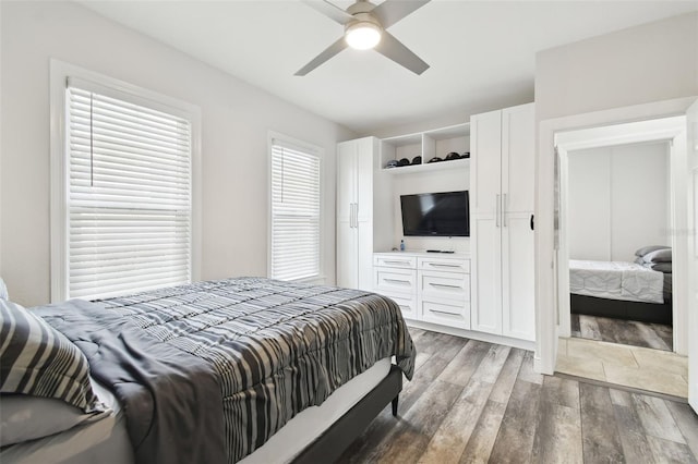 bedroom featuring dark hardwood / wood-style floors and ceiling fan