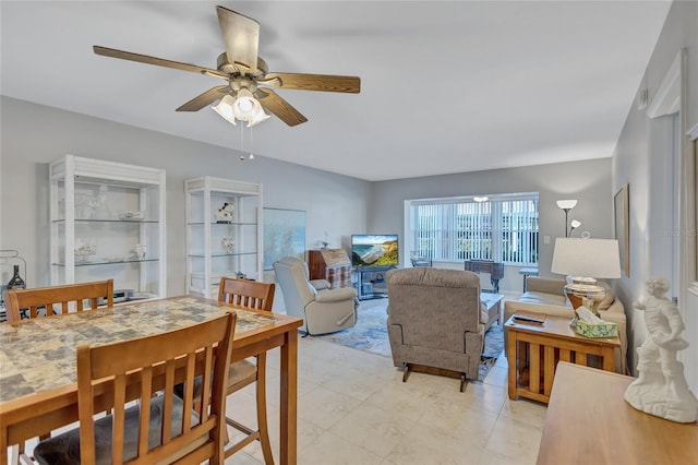 living room with ceiling fan and light tile patterned flooring