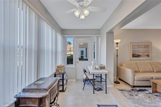 tiled living room featuring ceiling fan