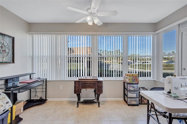 interior space featuring light tile patterned floors and ceiling fan