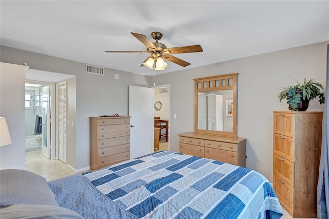 bedroom with connected bathroom, ceiling fan, and a closet