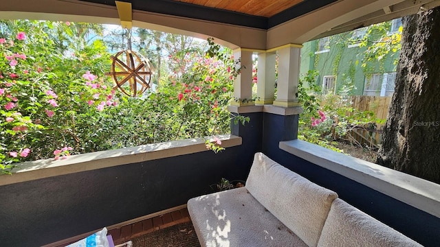 view of patio featuring a balcony