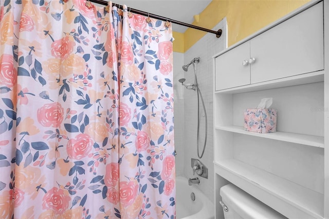 bathroom with shower / tub combo with curtain and toilet