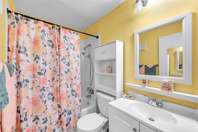 bathroom featuring vanity, shower / bath combination with curtain, and toilet