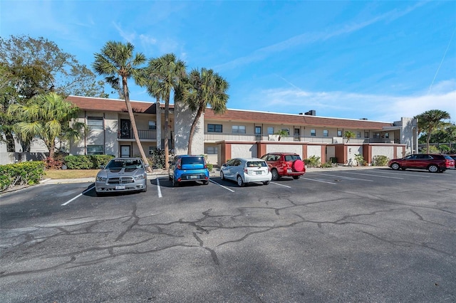 view of property featuring uncovered parking