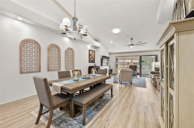 dining area featuring ceiling fan with notable chandelier and light hardwood / wood-style flooring