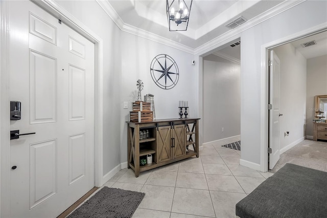 corridor with crown molding, light tile patterned flooring, and a chandelier