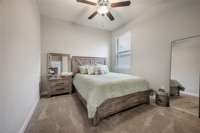 bedroom featuring ceiling fan and light colored carpet