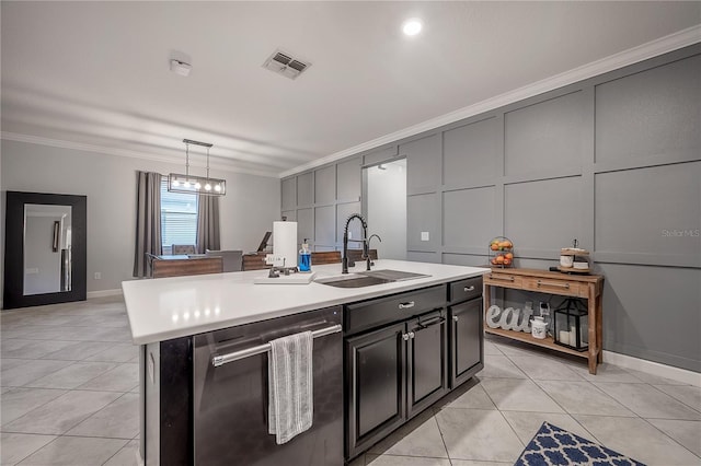 kitchen featuring sink, decorative light fixtures, stainless steel dishwasher, ornamental molding, and a kitchen island with sink