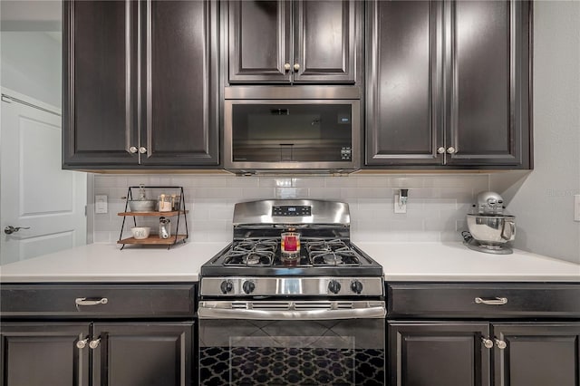 kitchen featuring gas range and decorative backsplash