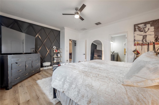 bedroom featuring crown molding, ceiling fan, and light hardwood / wood-style floors