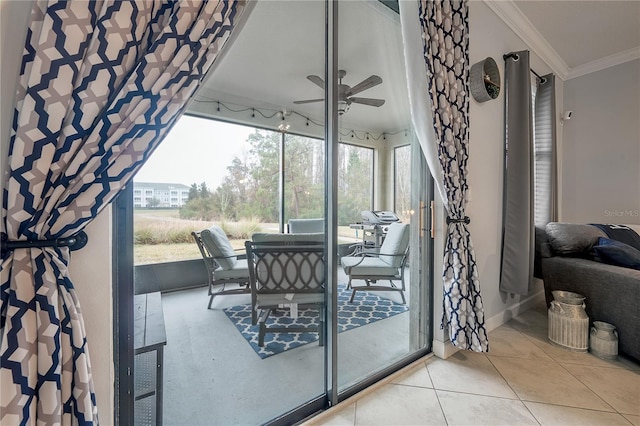 interior space with crown molding, tile patterned floors, and ceiling fan