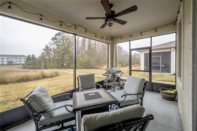 sunroom / solarium with ceiling fan