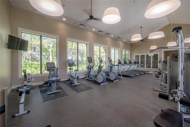 gym featuring plenty of natural light, high vaulted ceiling, and ceiling fan