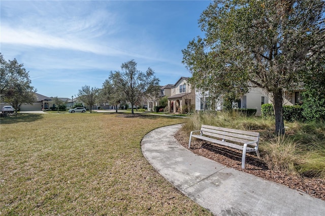 view of property's community with a yard