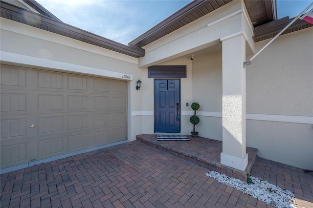 entrance to property featuring a garage