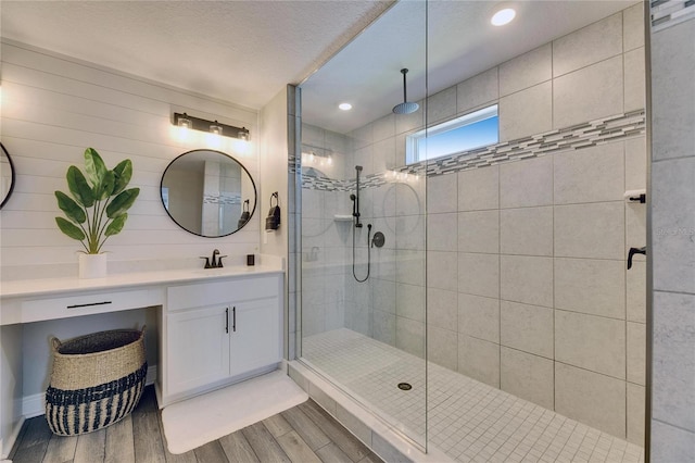 bathroom featuring vanity and tiled shower